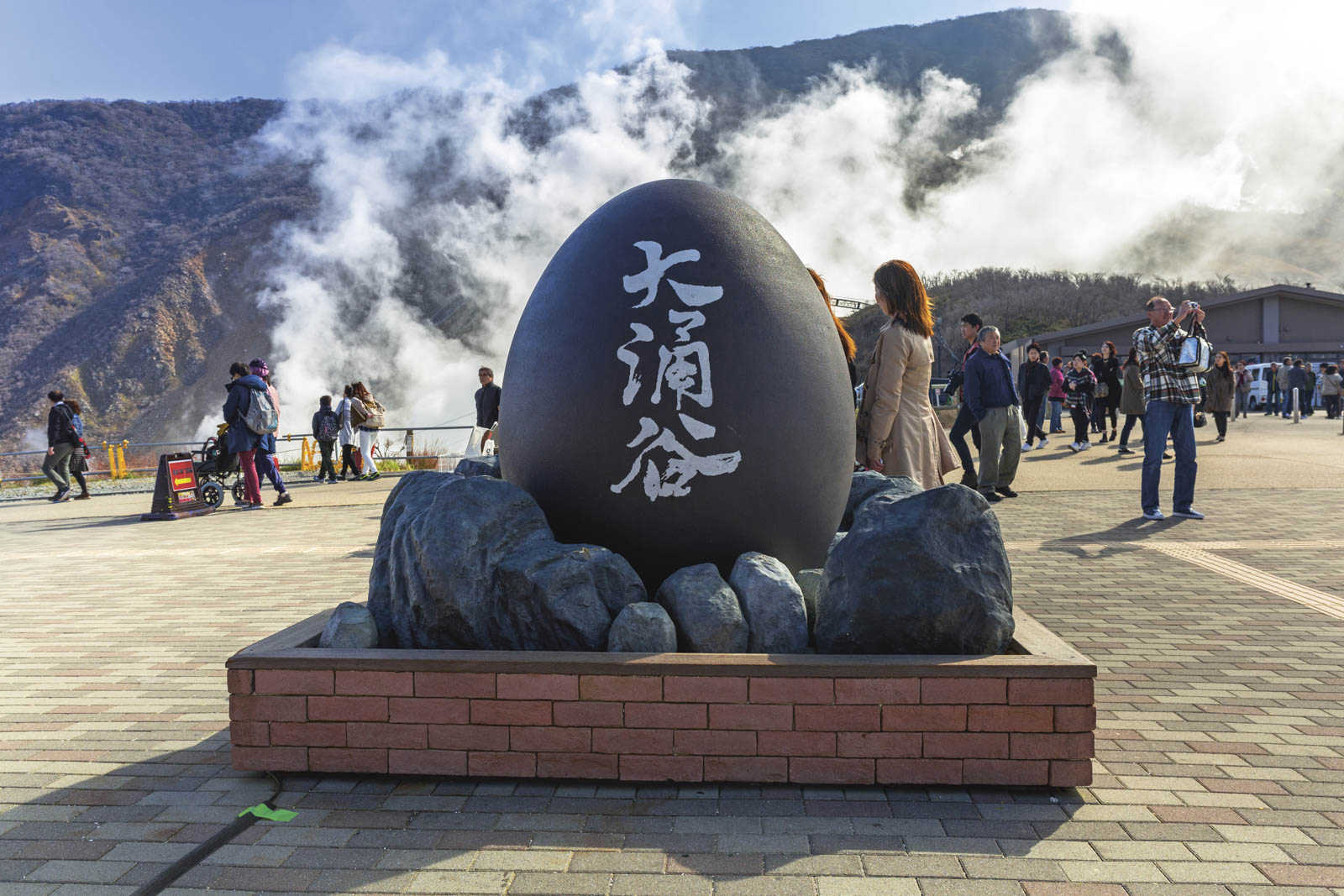 Tourists at the volcanic valley of Owakudani in Japan