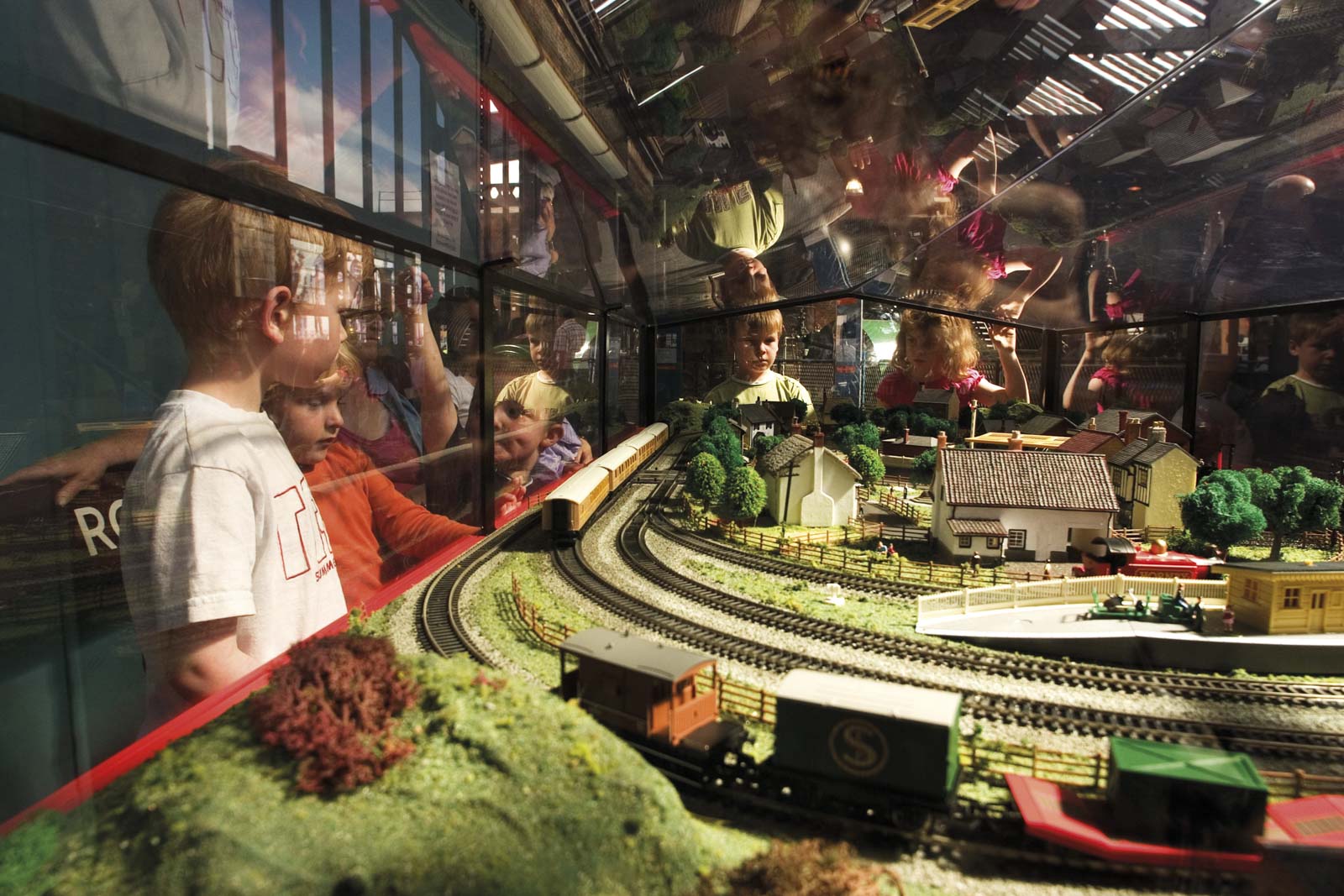 Children watching a model railway layout at the Museum of Science and Industry Manchester