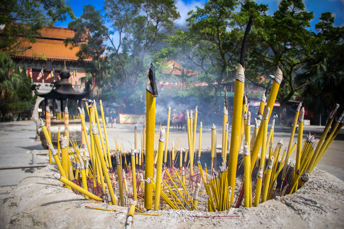 Burning incense at Hong Kong's famous Wong Tai Sin Temple
