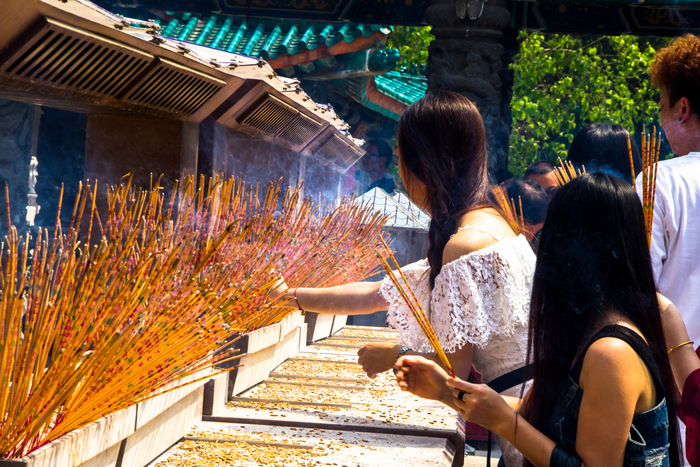Worshippers lighting incense at Hong Kong's Po Lin Monastery