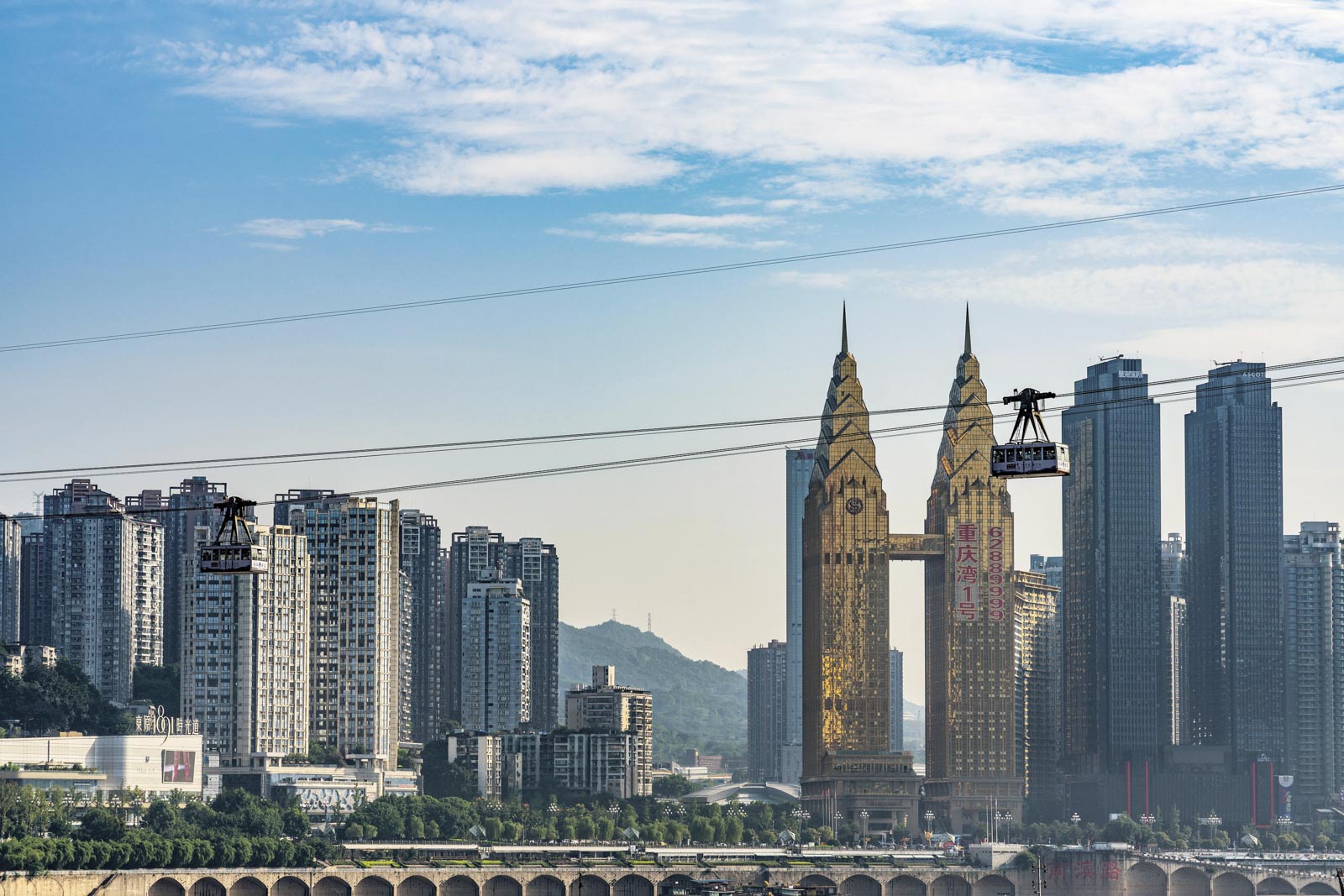 View of the Ropeway of the Yangtze river, a famous cable car which crosses the river with city buildings, Chongqing, China