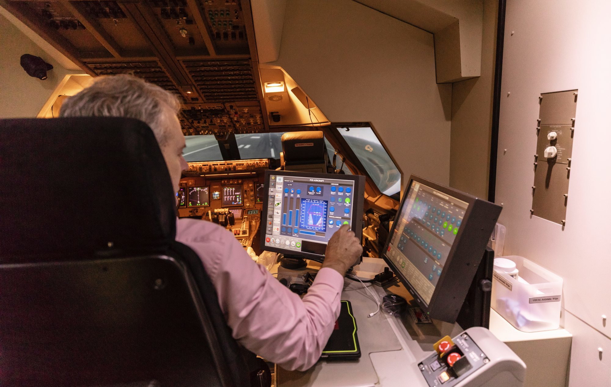 Cathay Pacific pilot trains on flight simulator
