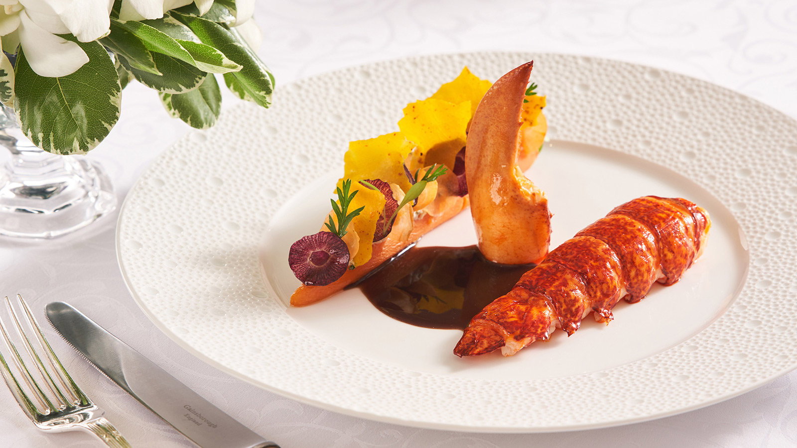 One-Michelin-starred Gaddi's signature poached lobster with red wine sauce, carrots and smoked ricotta