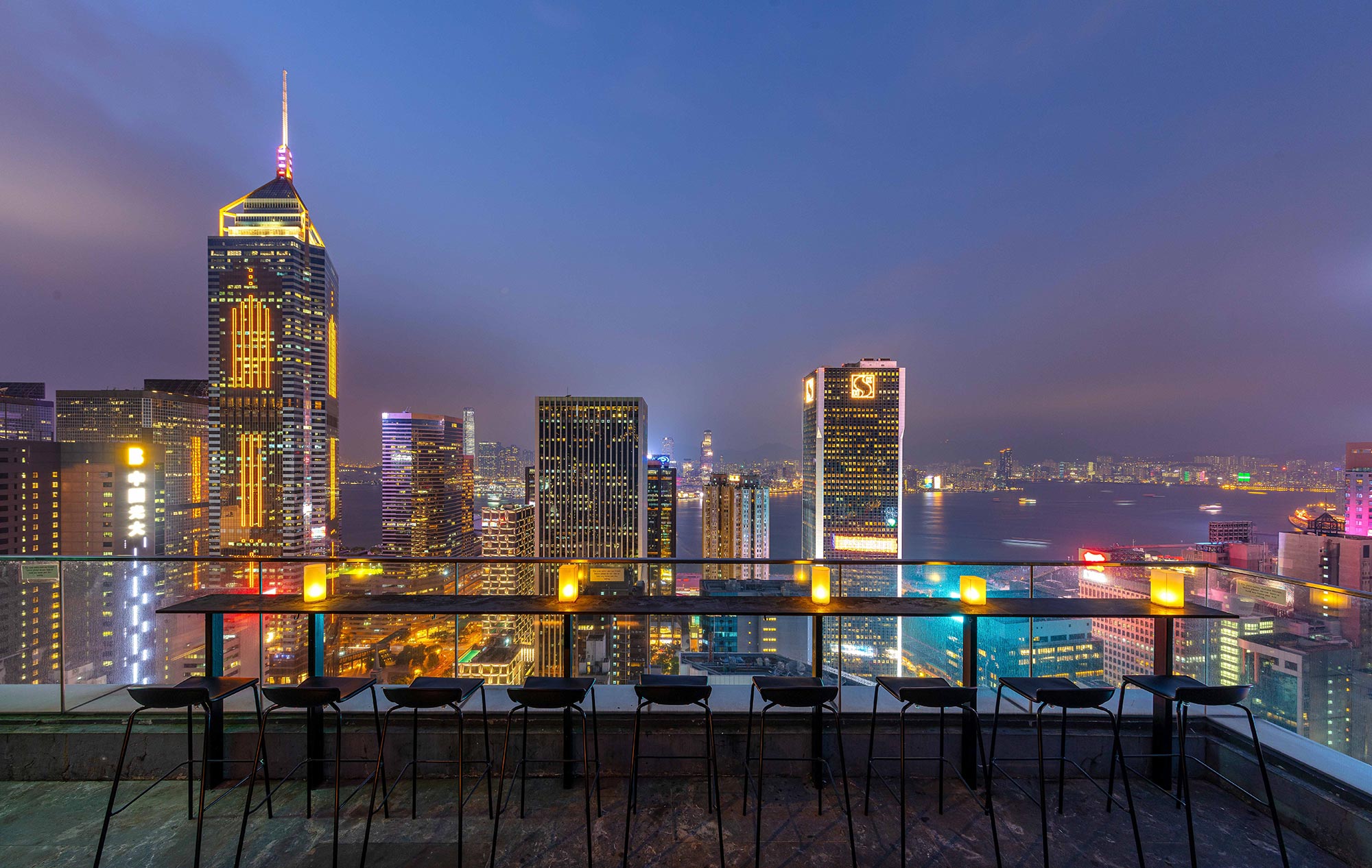 Nighttime skyline view of Hong Kong from Wooloomooloo rooftop bar