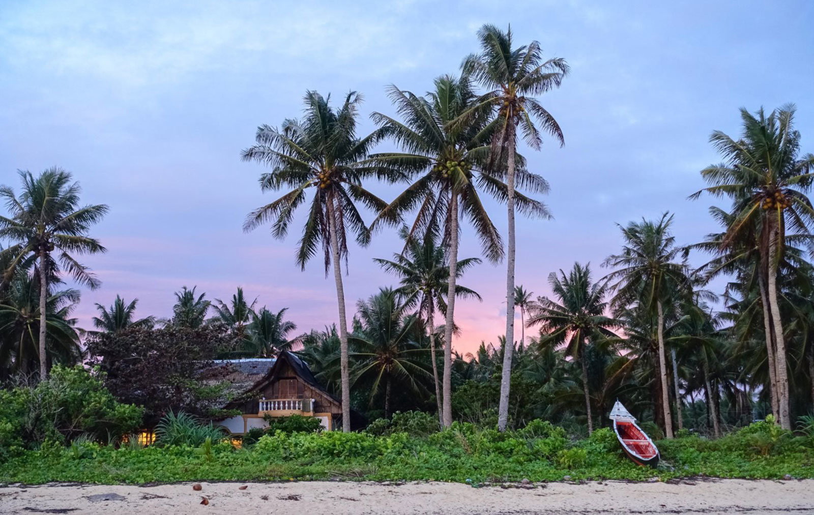 Beach resort and oink sunset at Siargao, Philippines