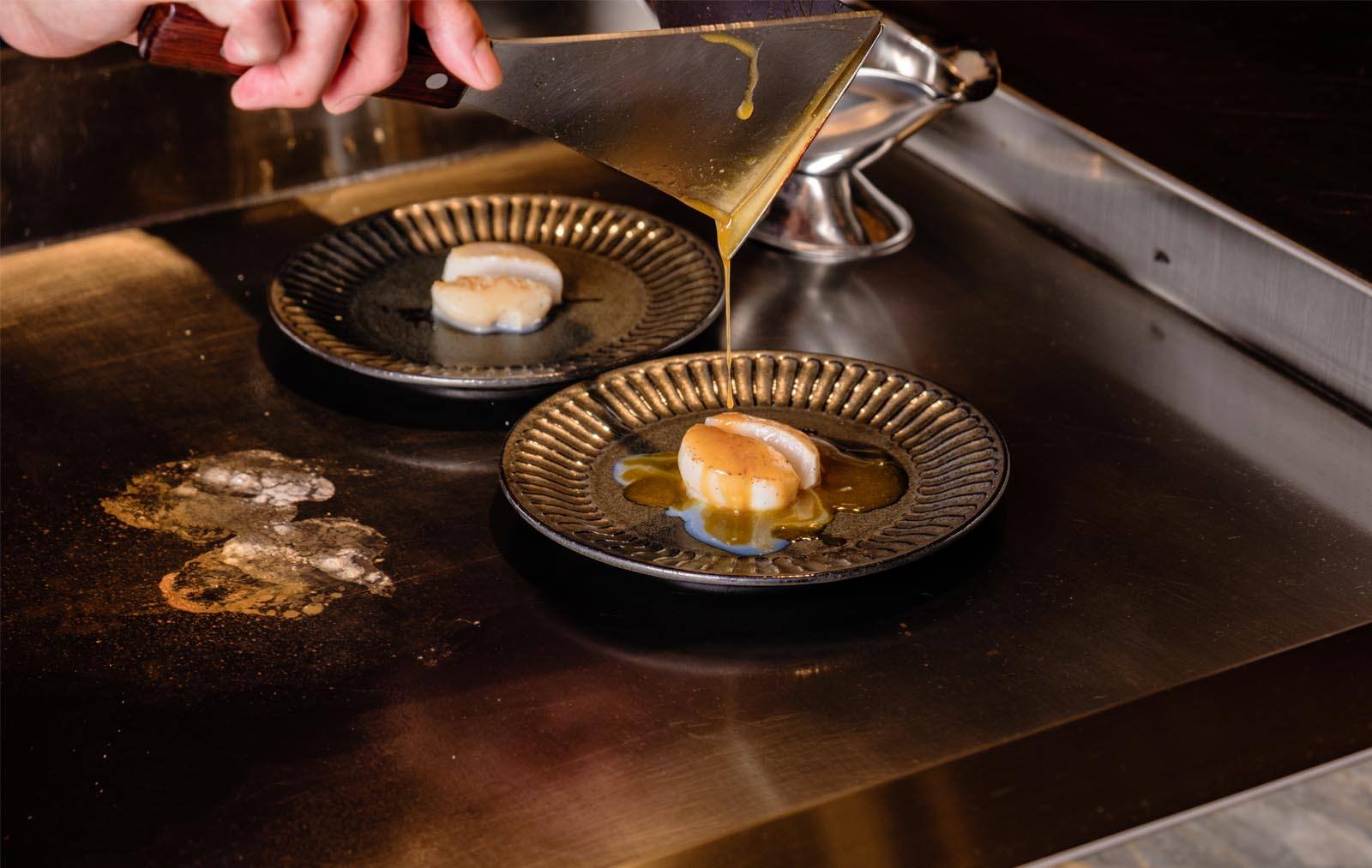 Things to do in Hong Kong in March include eating fresh Hokkaido scallops at Crown Super Deluxe