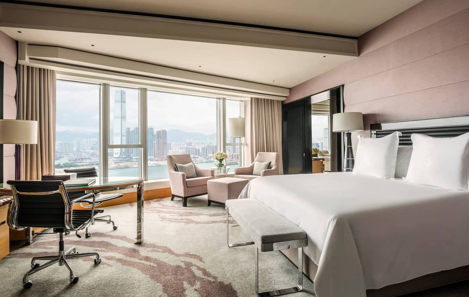 Room interior with city skyline view at the Four Seasons Hong Kong