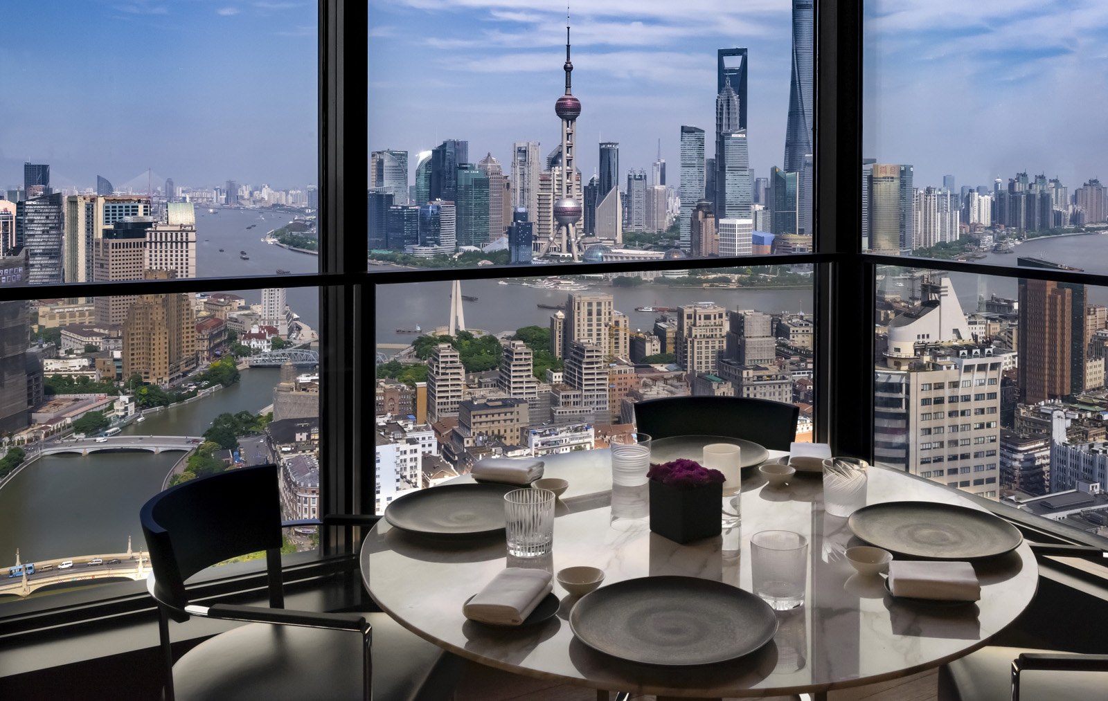 View of Shanghai neighbourhoods and skyline from a table at Il Ristorante at the Bulgari