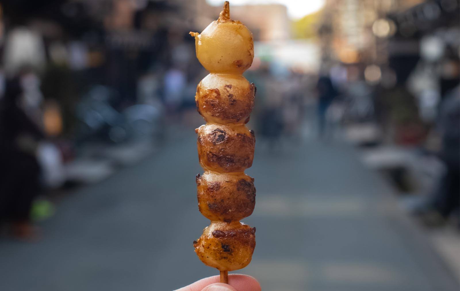 Mitarashi-dango street food skewers popular in Osaka, Japan
