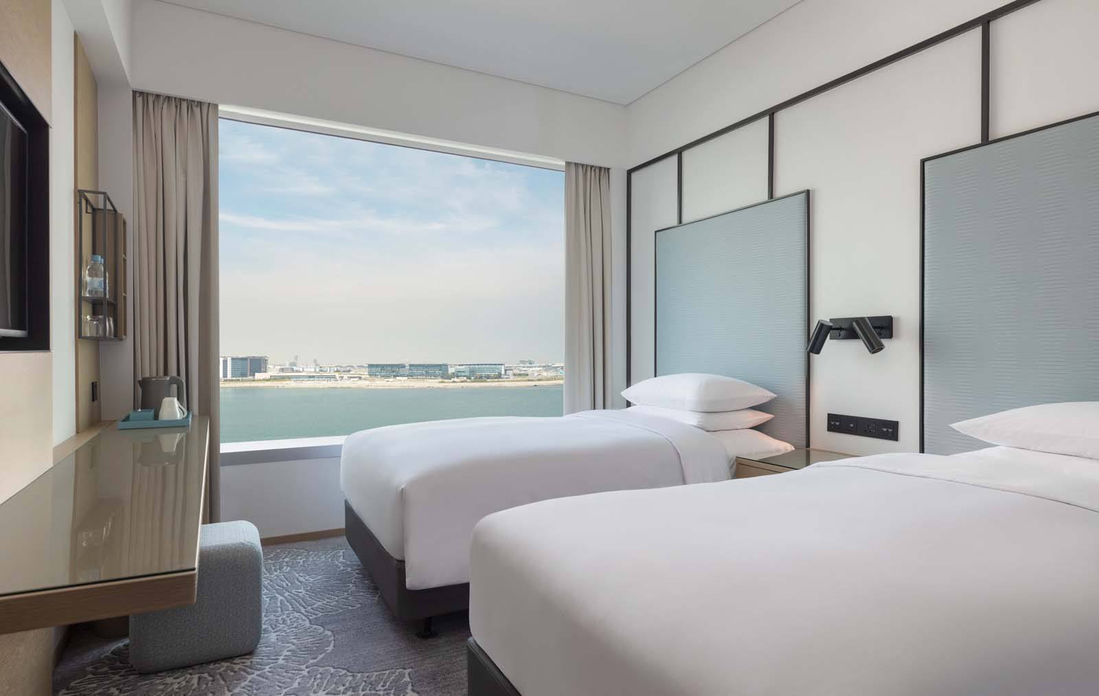 Interior of a traditional oceanview twin bedroom at Four Points by Sheraton hotel in Hong Kong