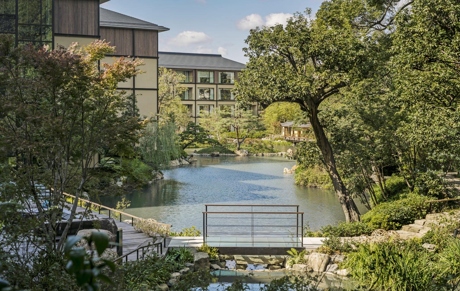 Four Seasons Hotel Kyoto features a 12th-century pond garden with cherry and maple trees