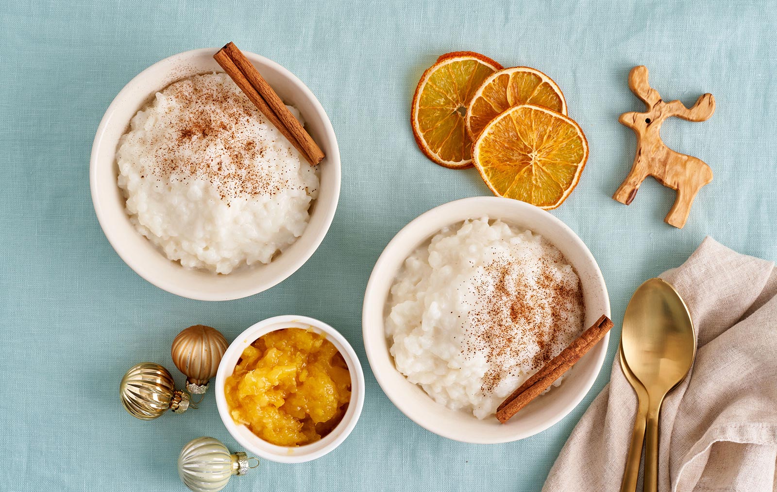 Norwegian comforting Christmas dish risengrynsgrøt: a creamy rice porridge sprinkled with cinnamon, sugar and vanilla