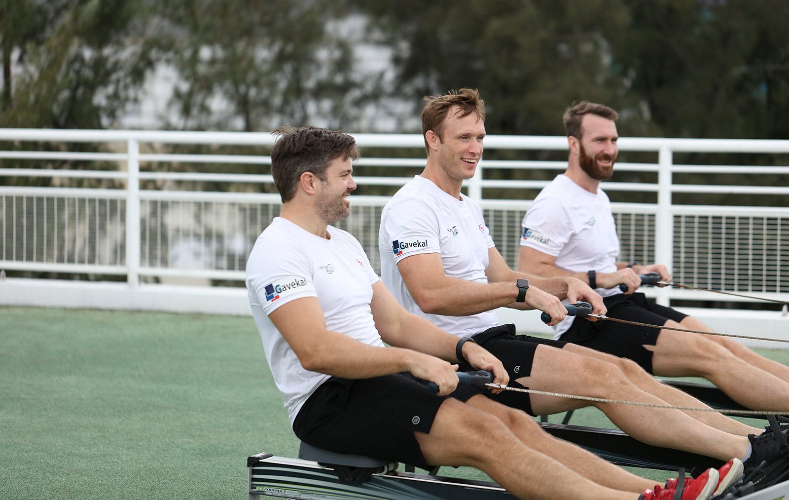 east rows west team training on rowing machines