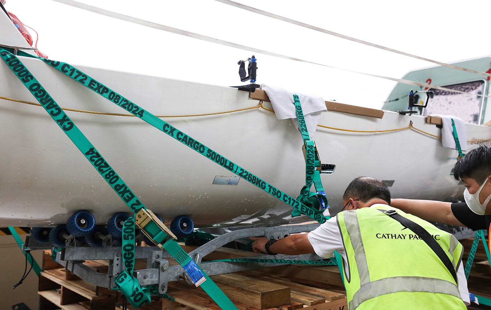 cathay pacific cargo team securing rowing boat